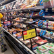 a woman and child in a supermarket